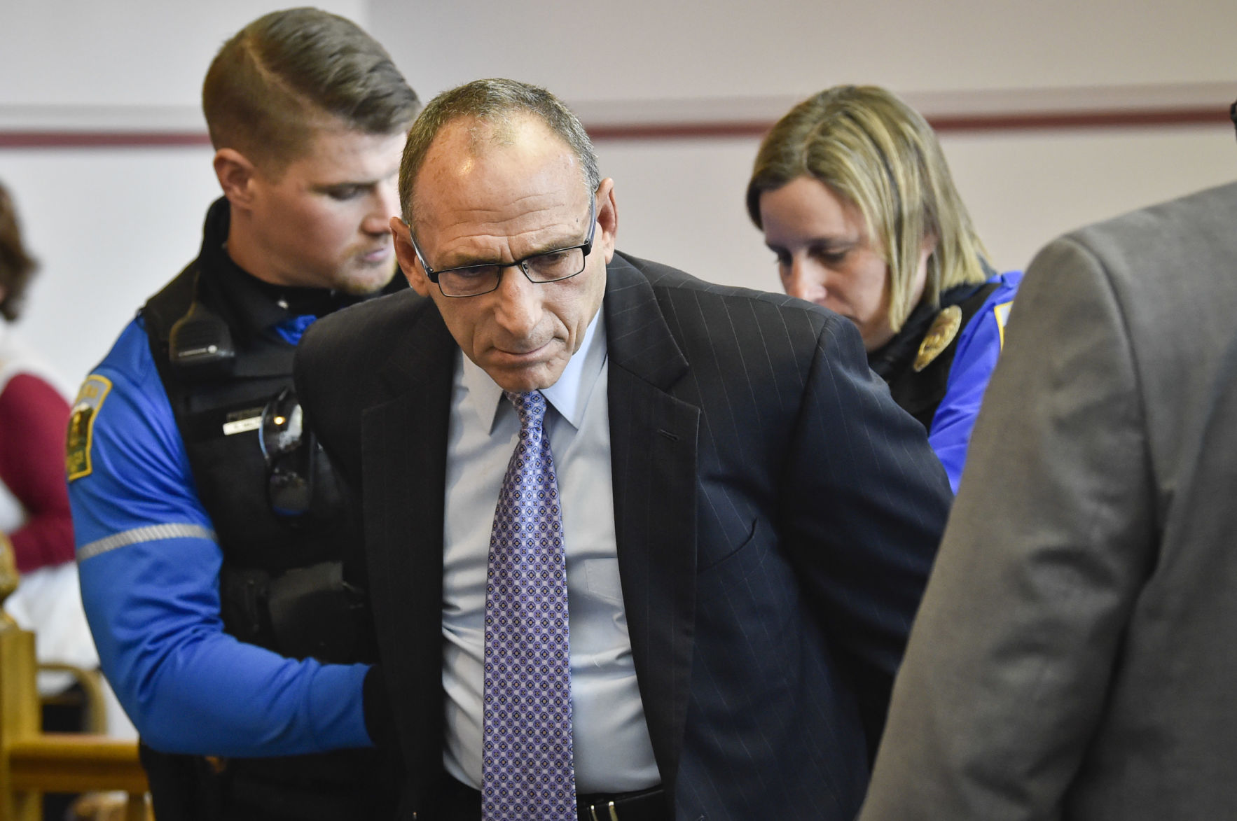 Gregg Trude is handcuffed in Lewis and Clark County Courthouse
